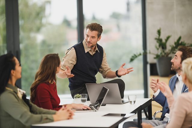 Presenter engaging a small group in conversation
