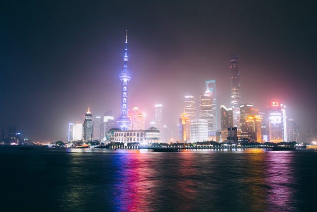 City skyline lit up at night across the water